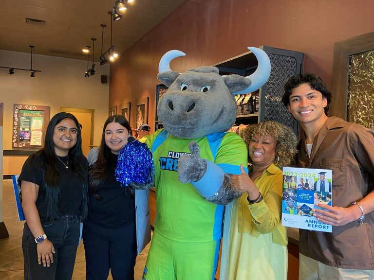 Clovis Community College President Dr. Kim E Armstrong with the "Clovis Crush" mascot and students who came to visit the Coffee With the President event (Photo provided by Stephanie Babb, Clovis Community College).