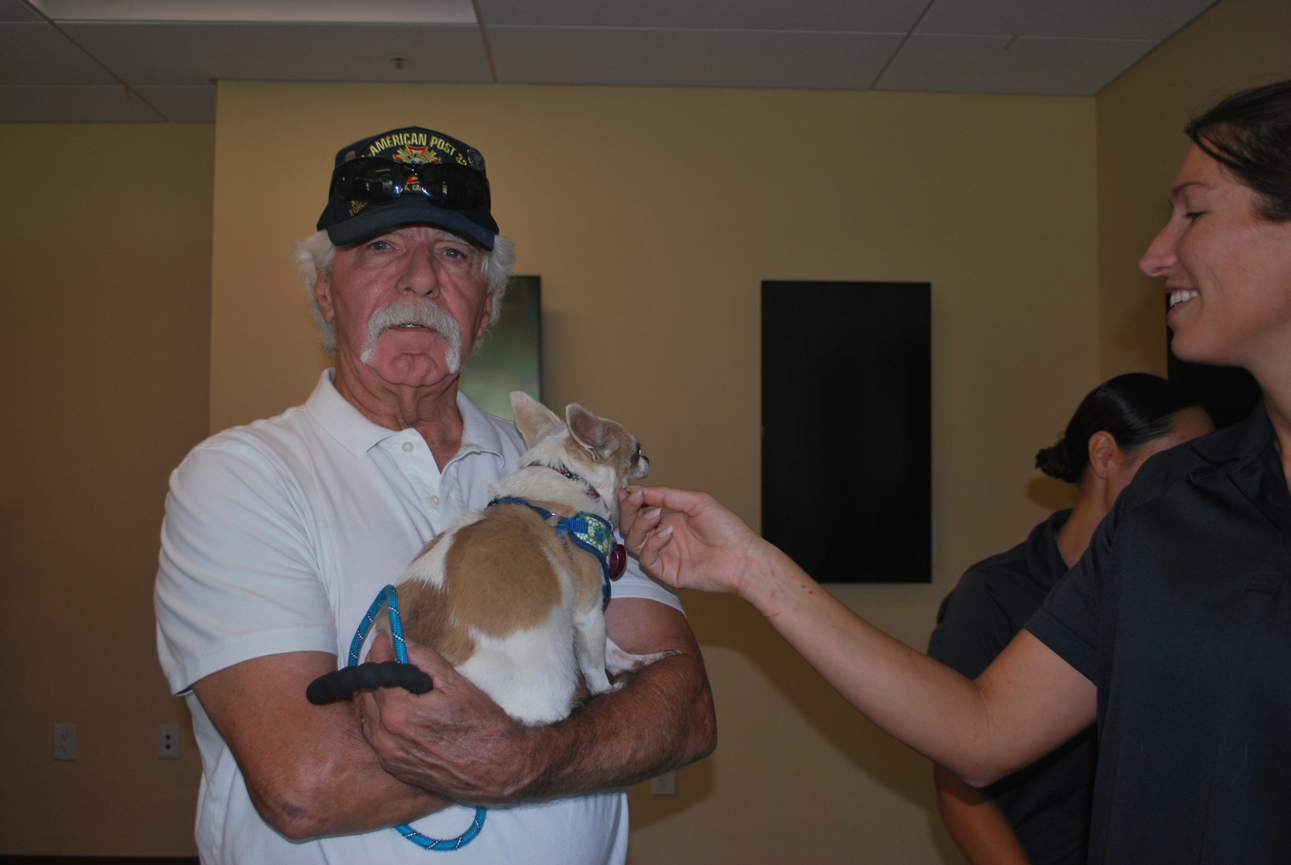 Jerry Hayden, a longtime supporter of Miss Winkle's Pet Adoption Center, with his chihuahua Fancy at the low-cost vaccination clinic on September 28 (photo by Hannah-Grace Leece, Clovis Roundup).