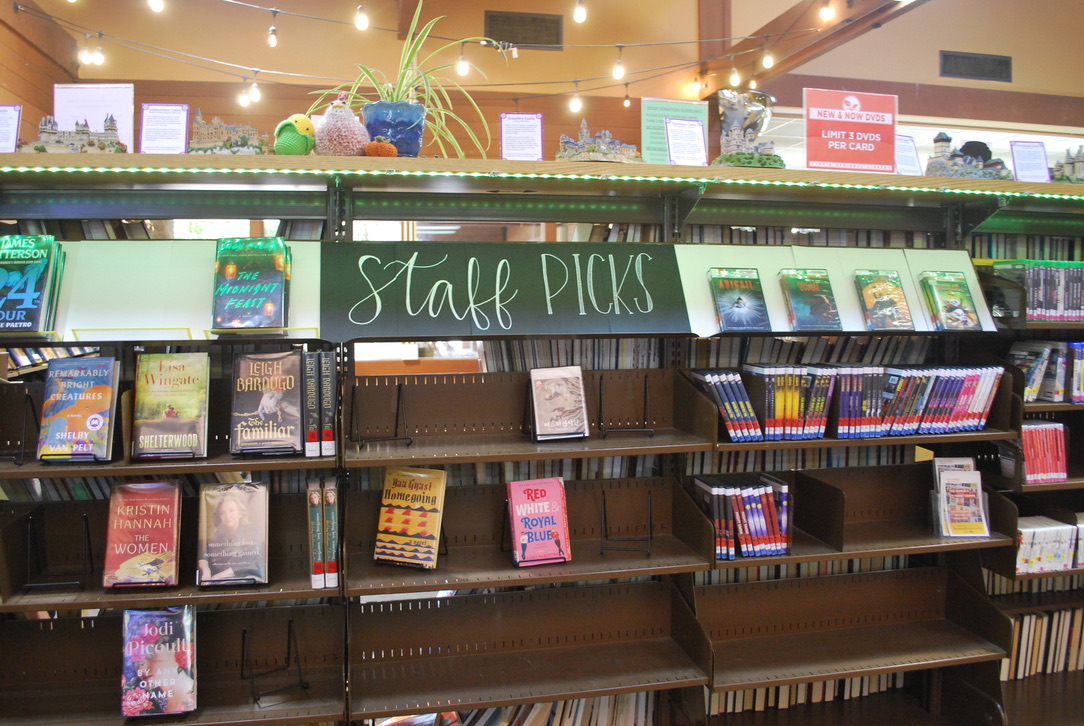 The shelf of "Staff Picks" at the Clovis Library, showcasing the favorite books of the library staff (photo by Hannah-Grace Leece, Clovis Roundup).