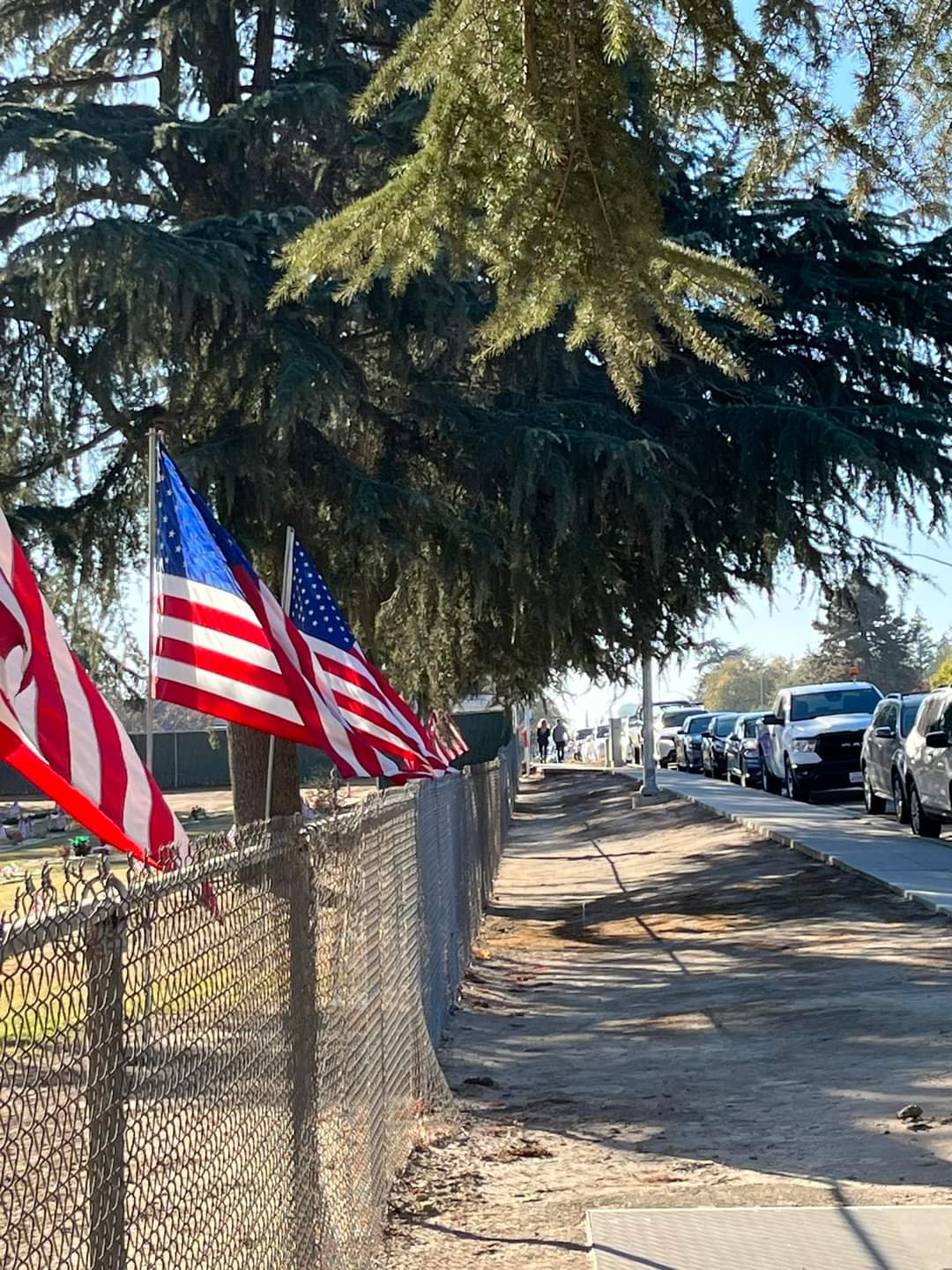 The outside of Clovis Cemetery prominently displays American flags during the annual wreath-laying ceremony for Wreaths Across America on December 16th, 2023 (photo courtesy of Kim Correia Dettman Facebook page).