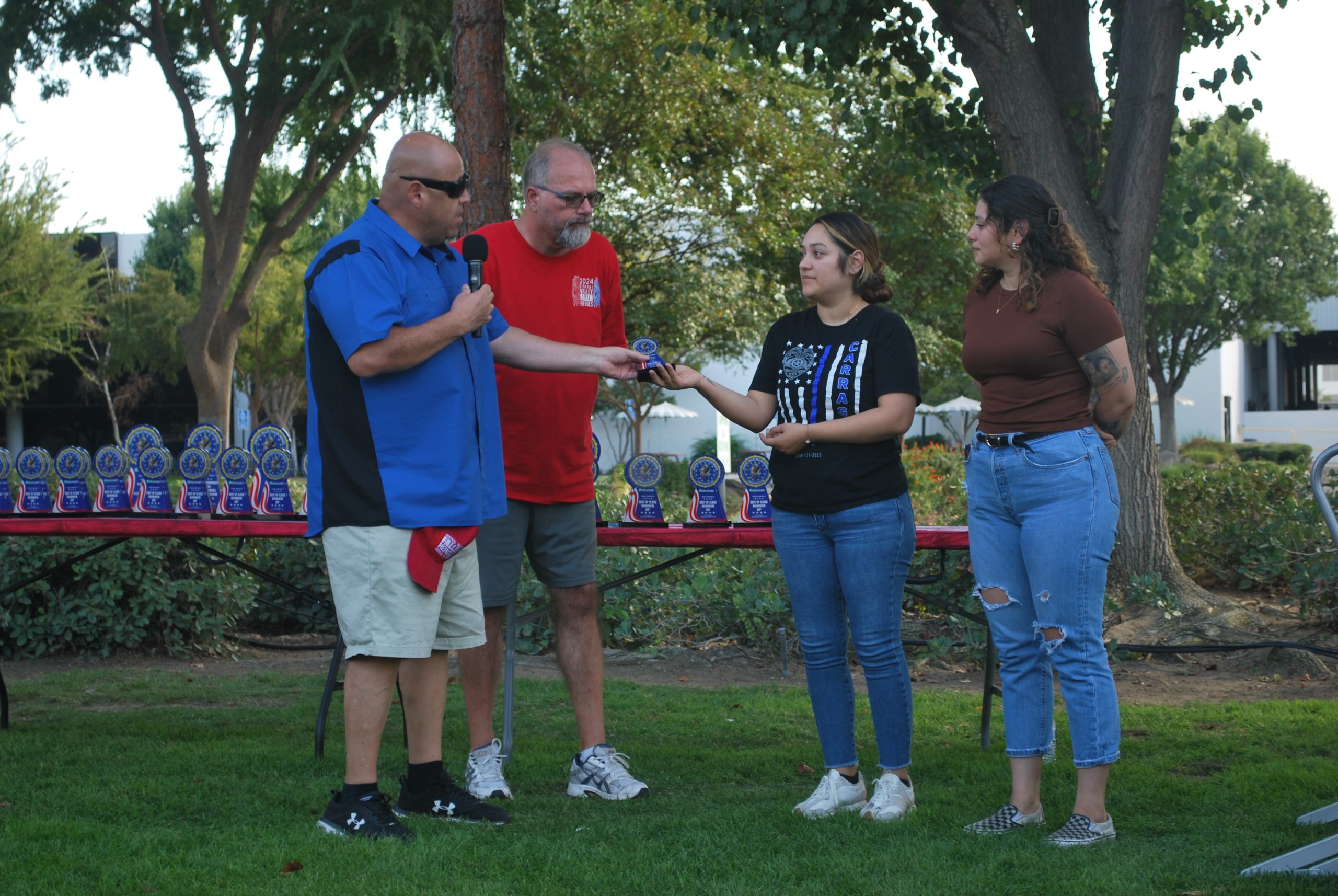 The Central Valley Mustangs Club presents an award to the family of a fallen hero to honor Gonzalo Carrasco Jr., a Selma police officer who was shot and killed in the line of duty in January 2023 (photo by Hannah-Grace Leece, Clovis Roundup).